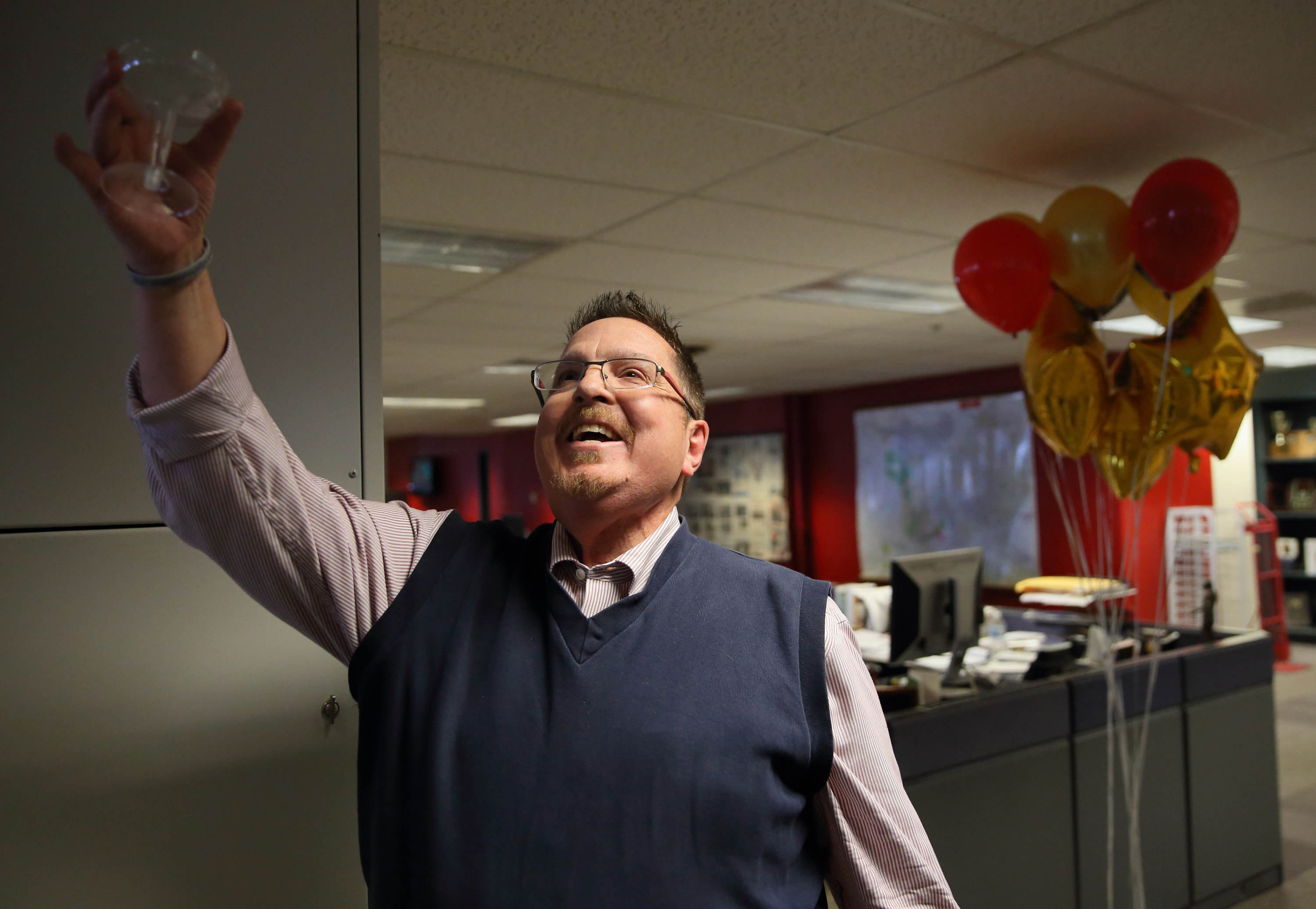 Former Loyola Phoenix staffer Tony Messenger celebrates in the newsroom after learning he won a Pulitzer Prize. Photo courtesy David Carson, St. Louis Post-Dispatch.