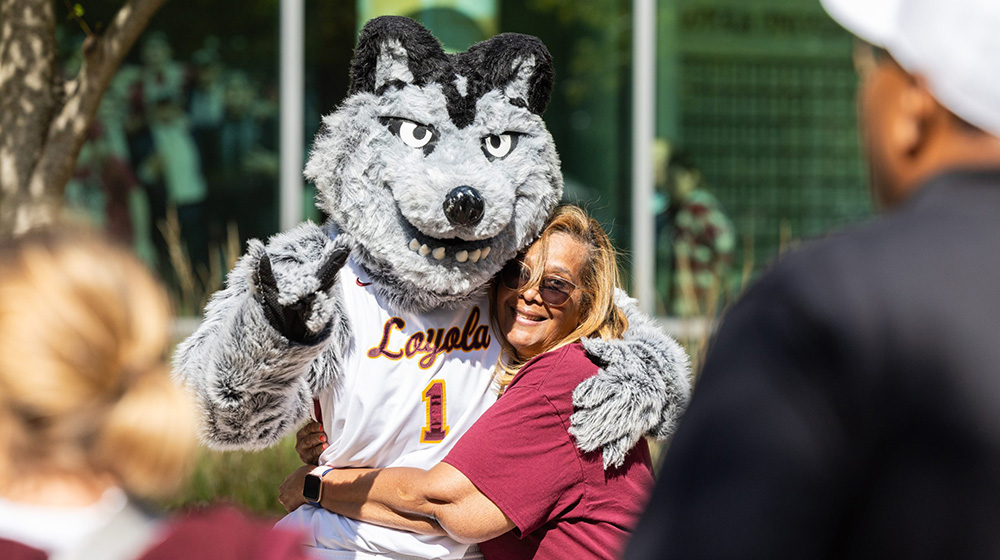 A mother hugs LU Wolf while posing for a picture at Family Weekend 2025. A mother hugs LU Wolf while posing for a picture at Family Weekend 2025.