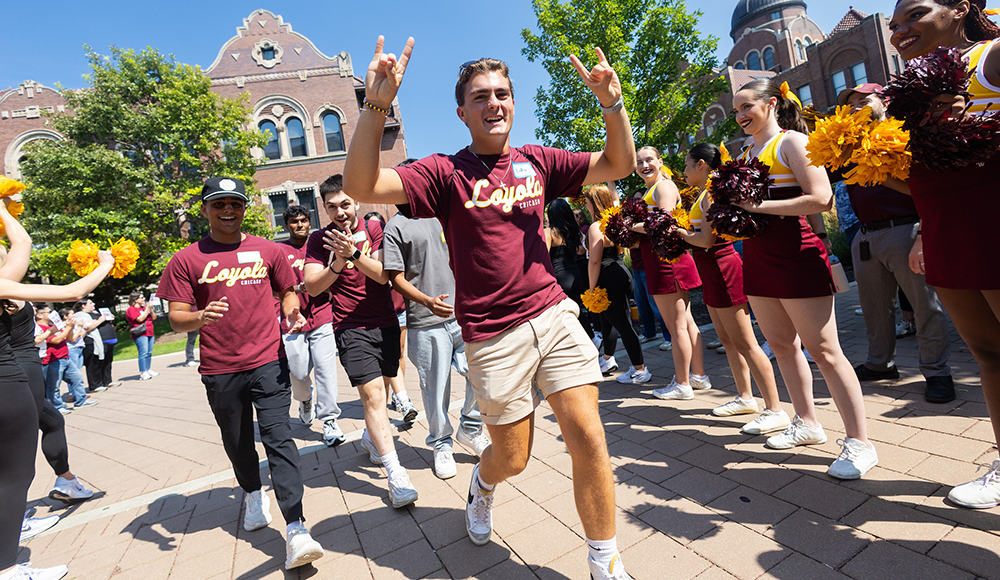 Students walk through the Cheer Tunnel at New Student Convocation. Students walk through the Cheer Tunnel at New Student Convocation.