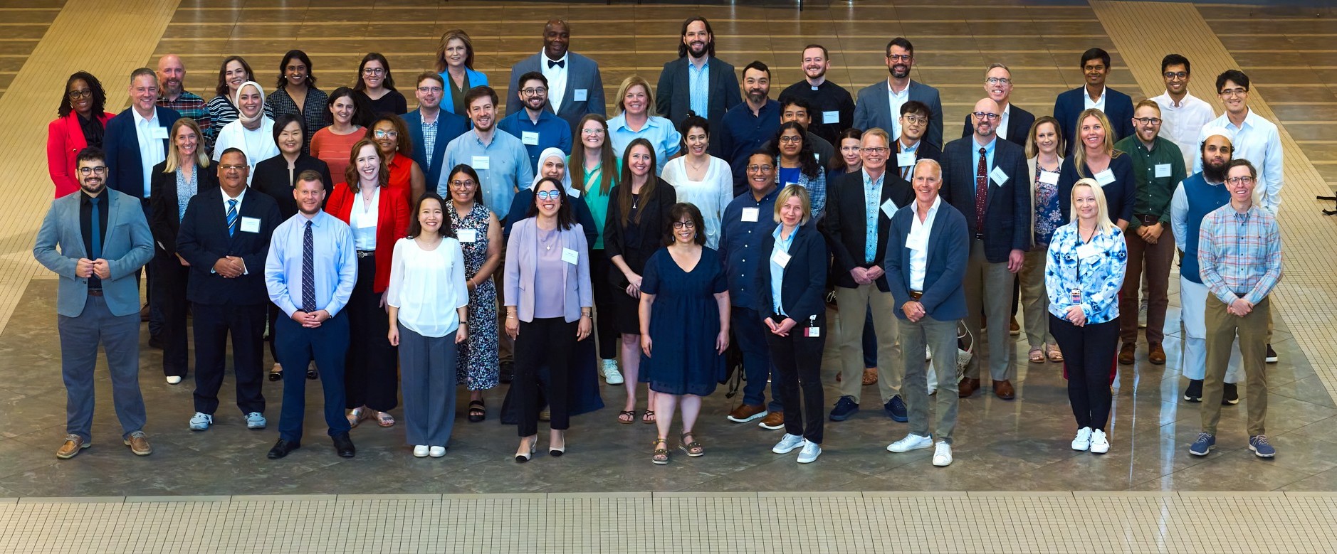 new faculty at new faculty orientation 2025 gathering for a group photo