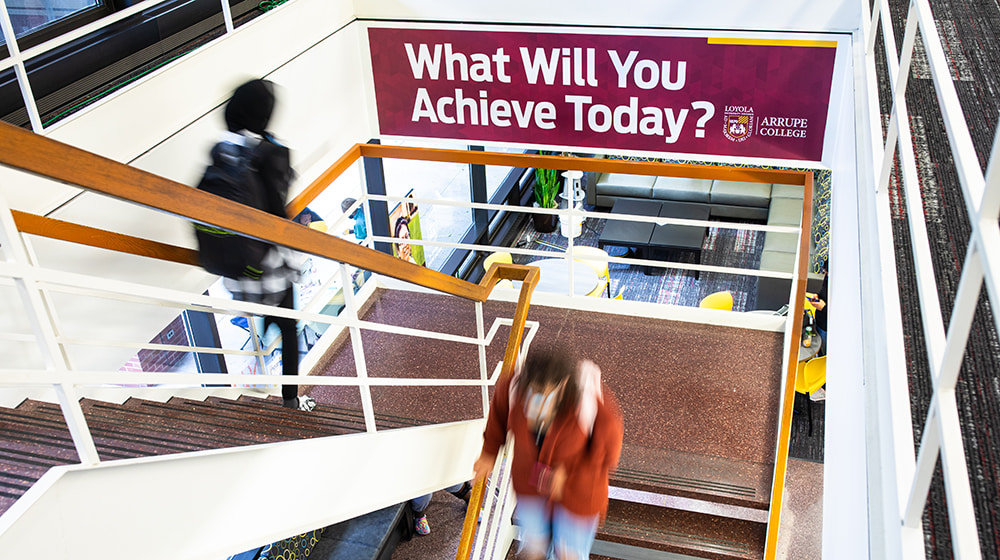 Arrupe students in the stairwell