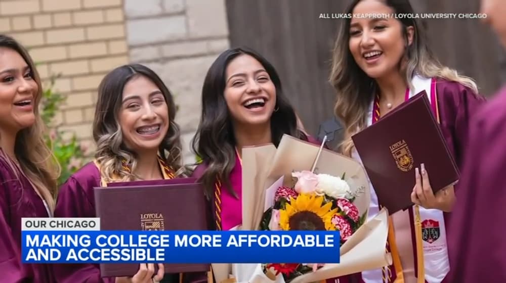 Four students smiling together outdoors during a Loyola University Chicago commencement