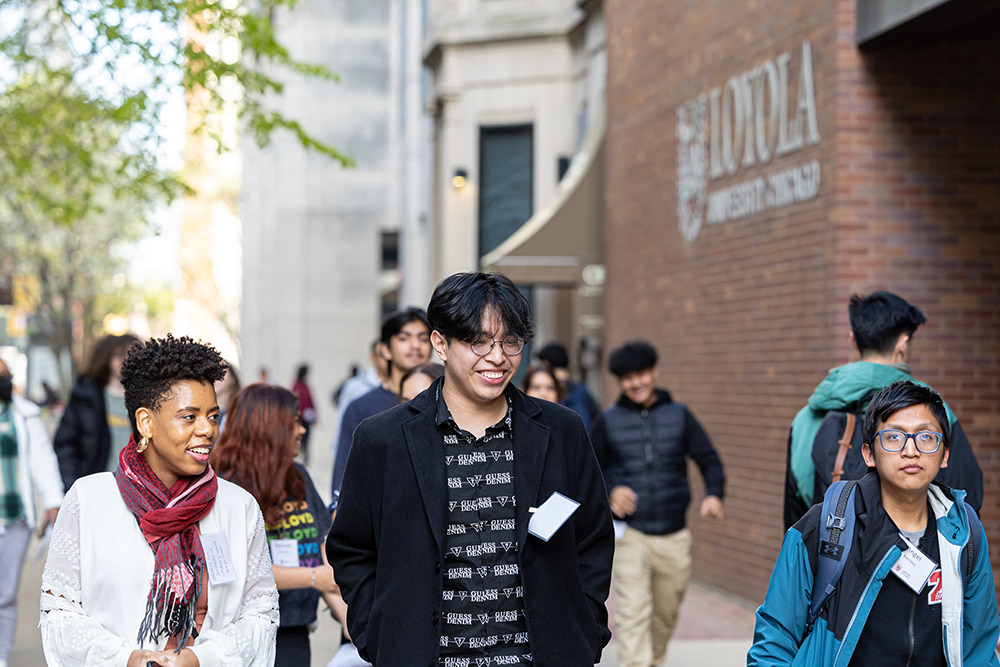students walking down sidewalk