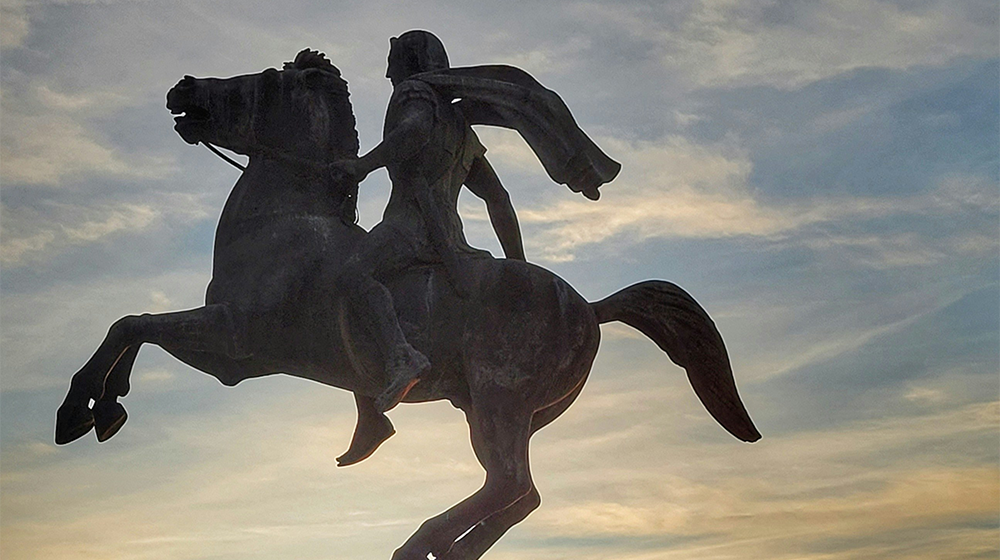 A metal statue of Alexander the Great riding a horse