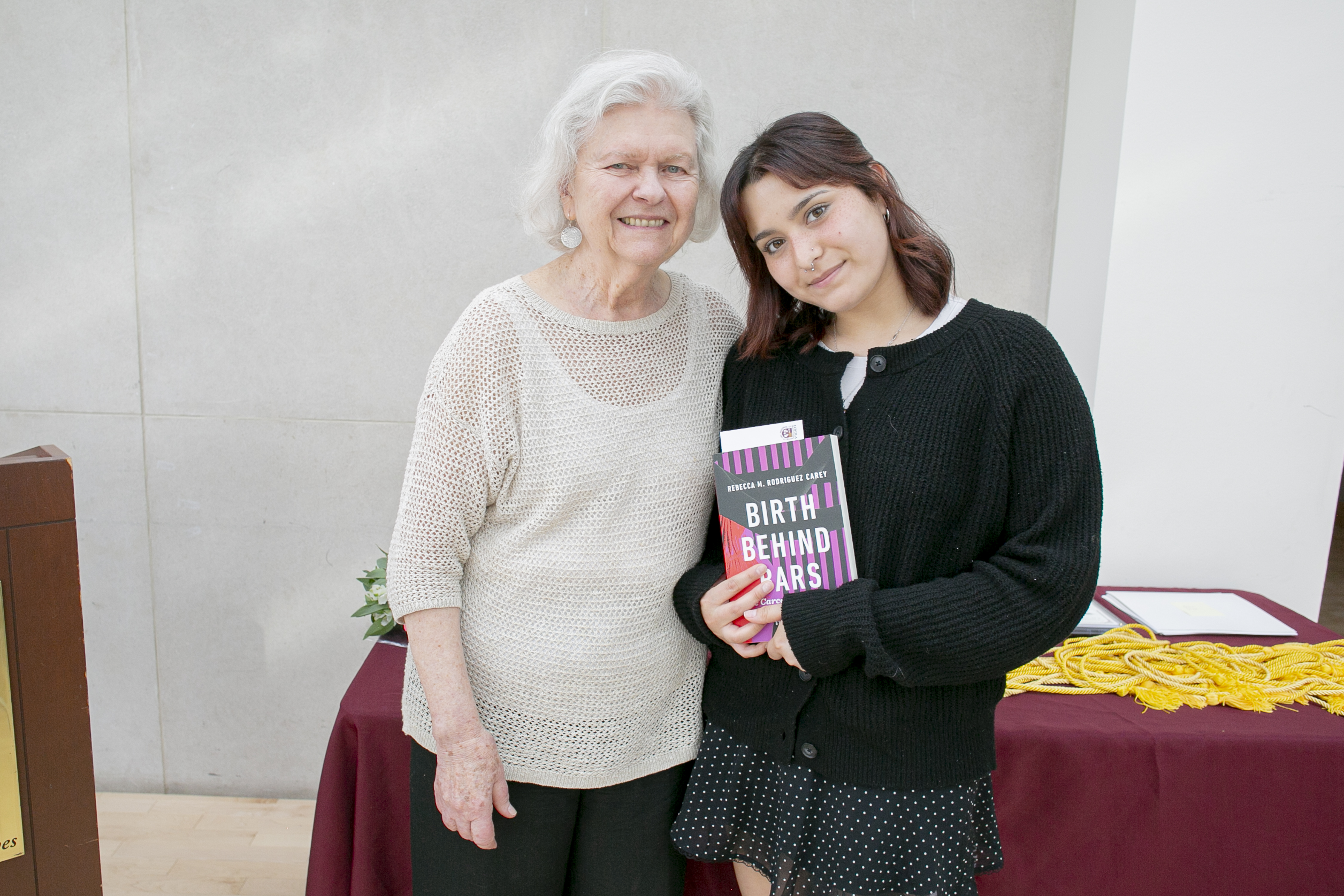 Emily Vela, winner of Bensinger Essay Contest Award, posing with Ana Bensinger