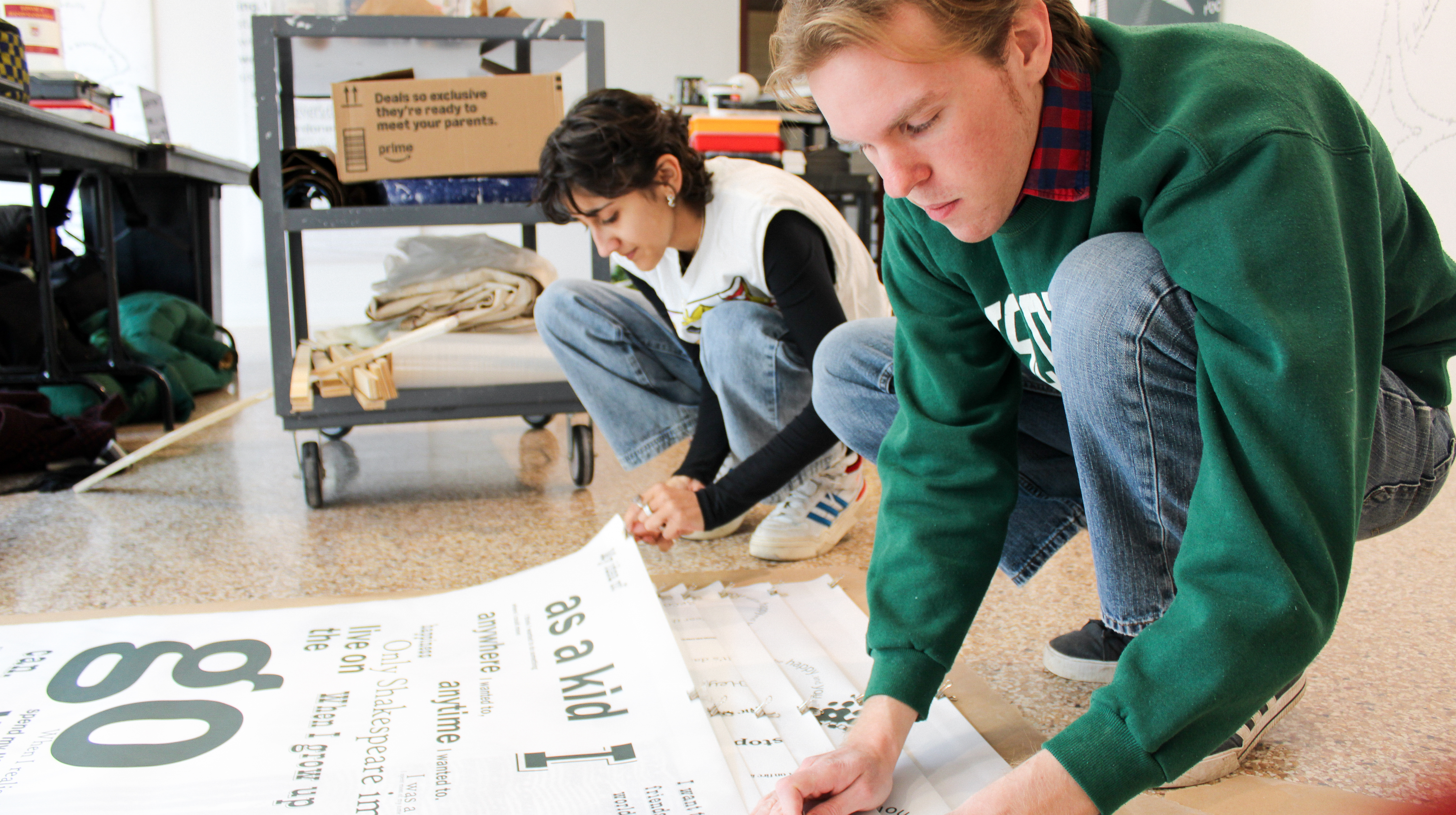 Students installing an exhibit at Ralph Arnold Gallery Students installing an exhibit at Ralph Arnold Gallery