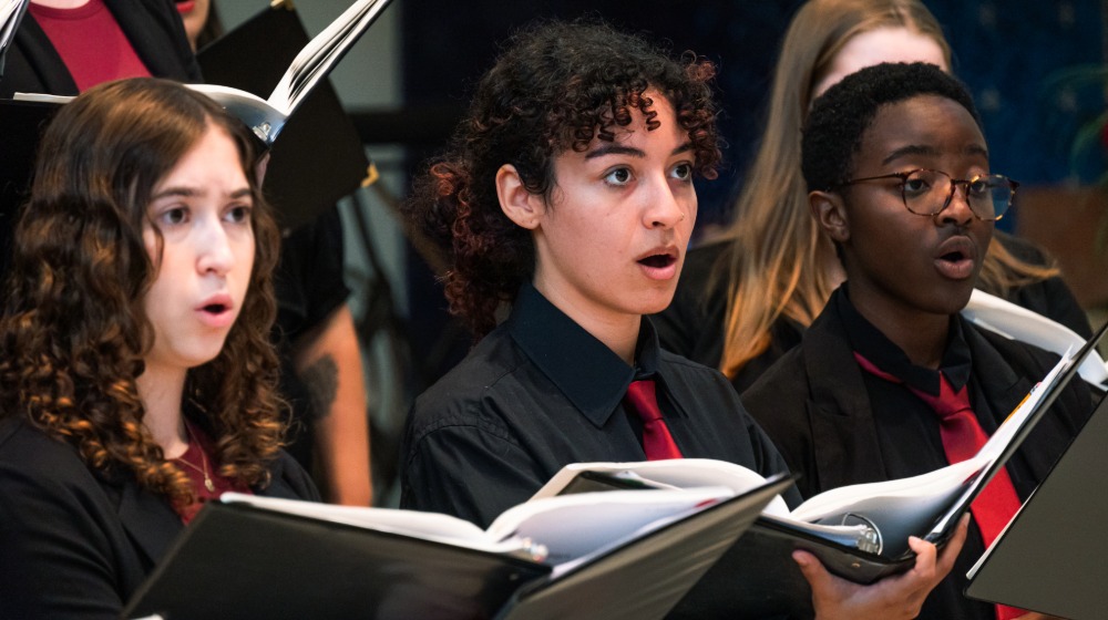 Ignatian Voices ensemble members singing Ignatian Voices ensemble members singing