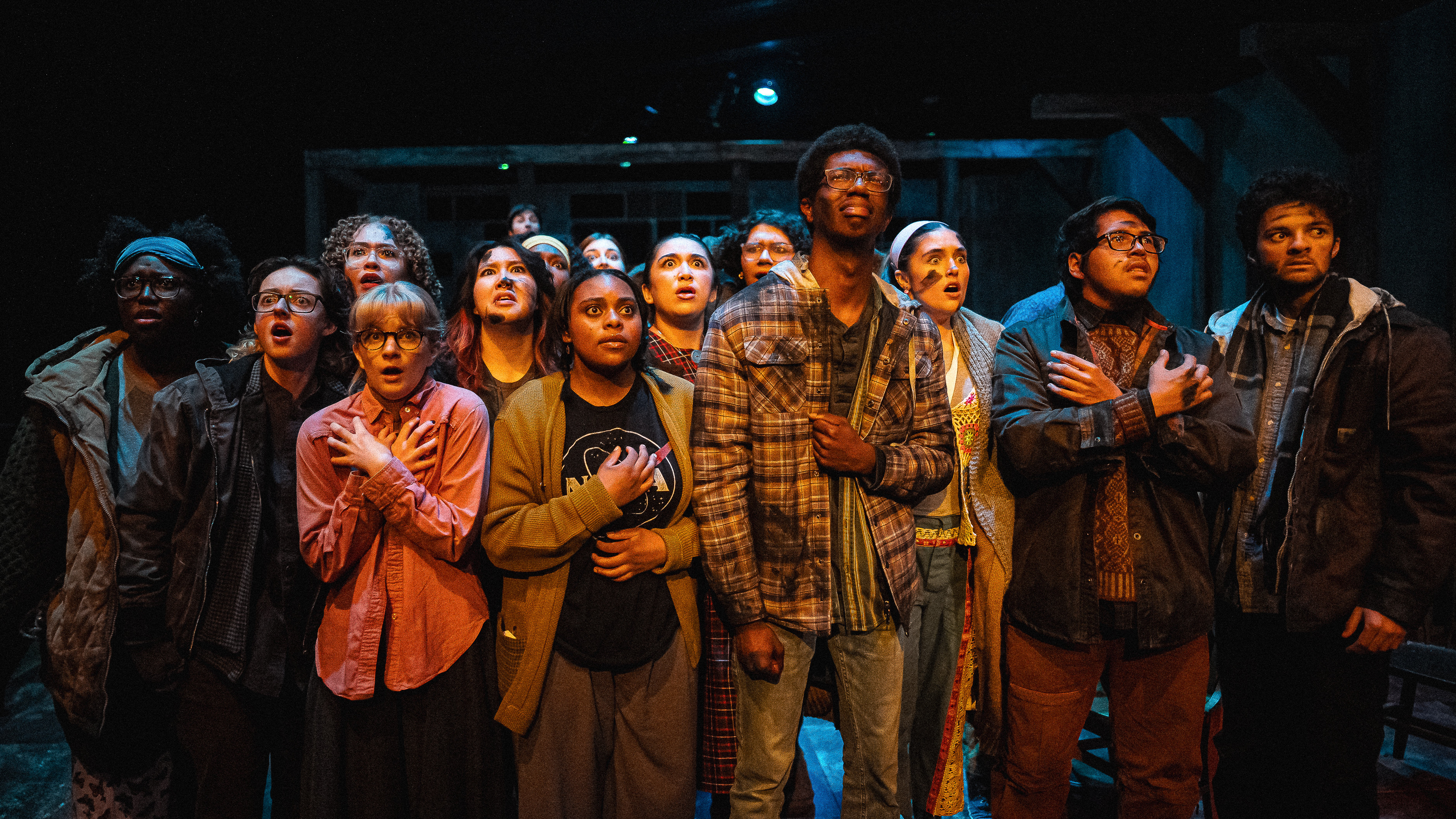 Loyola Theatre Students on the Newhart Family Theatre Stage clustered together during a scene from The Neighborhood of the Loners Loyola Theatre Students on the Newhart Family Theatre Stage clustered together during a scene from The Neighborhood of the Loners