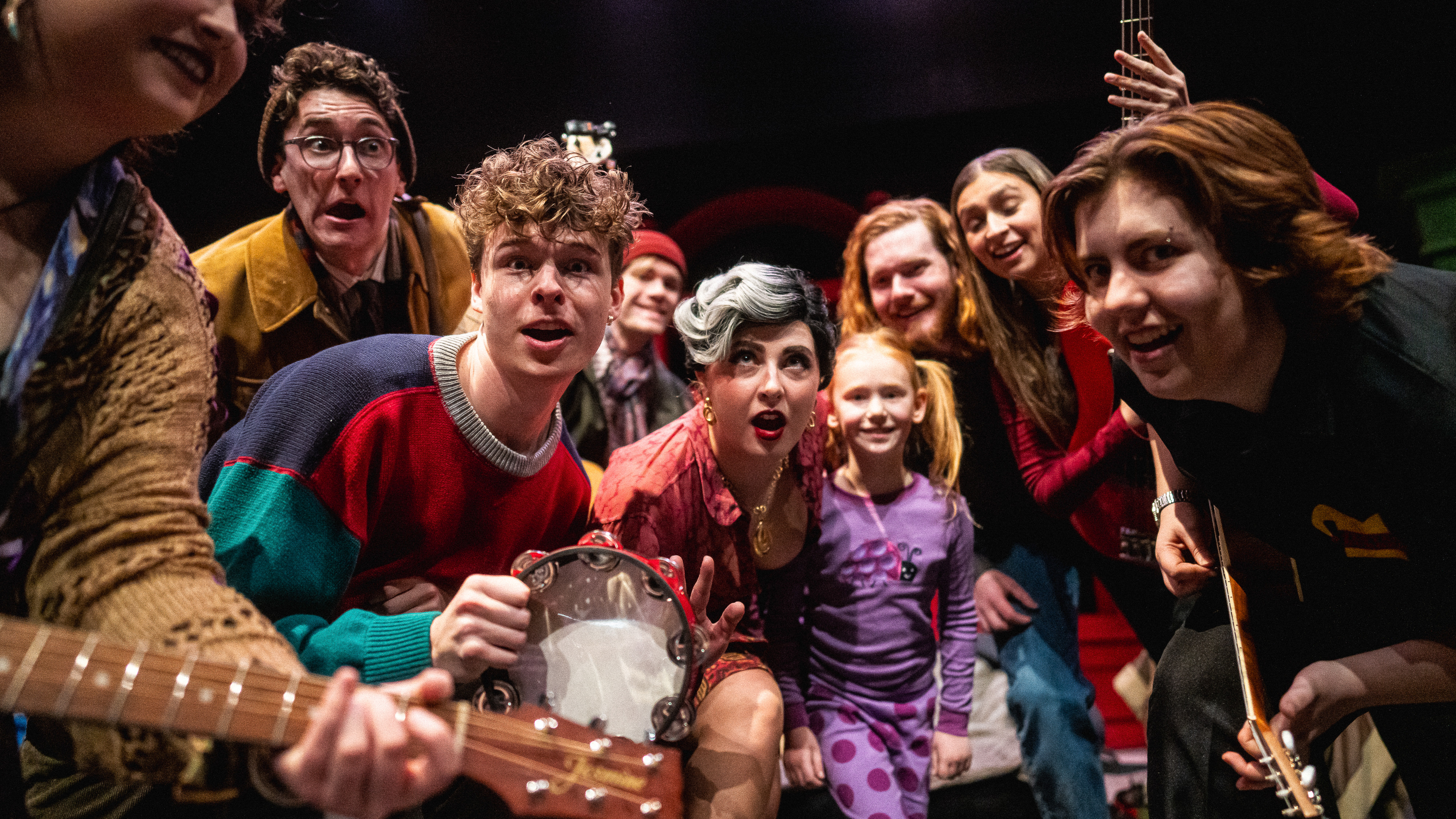 Loyola Theatre Students gathered around with instruments in their hands Loyola Theatre Students gathered around with instruments in their hands