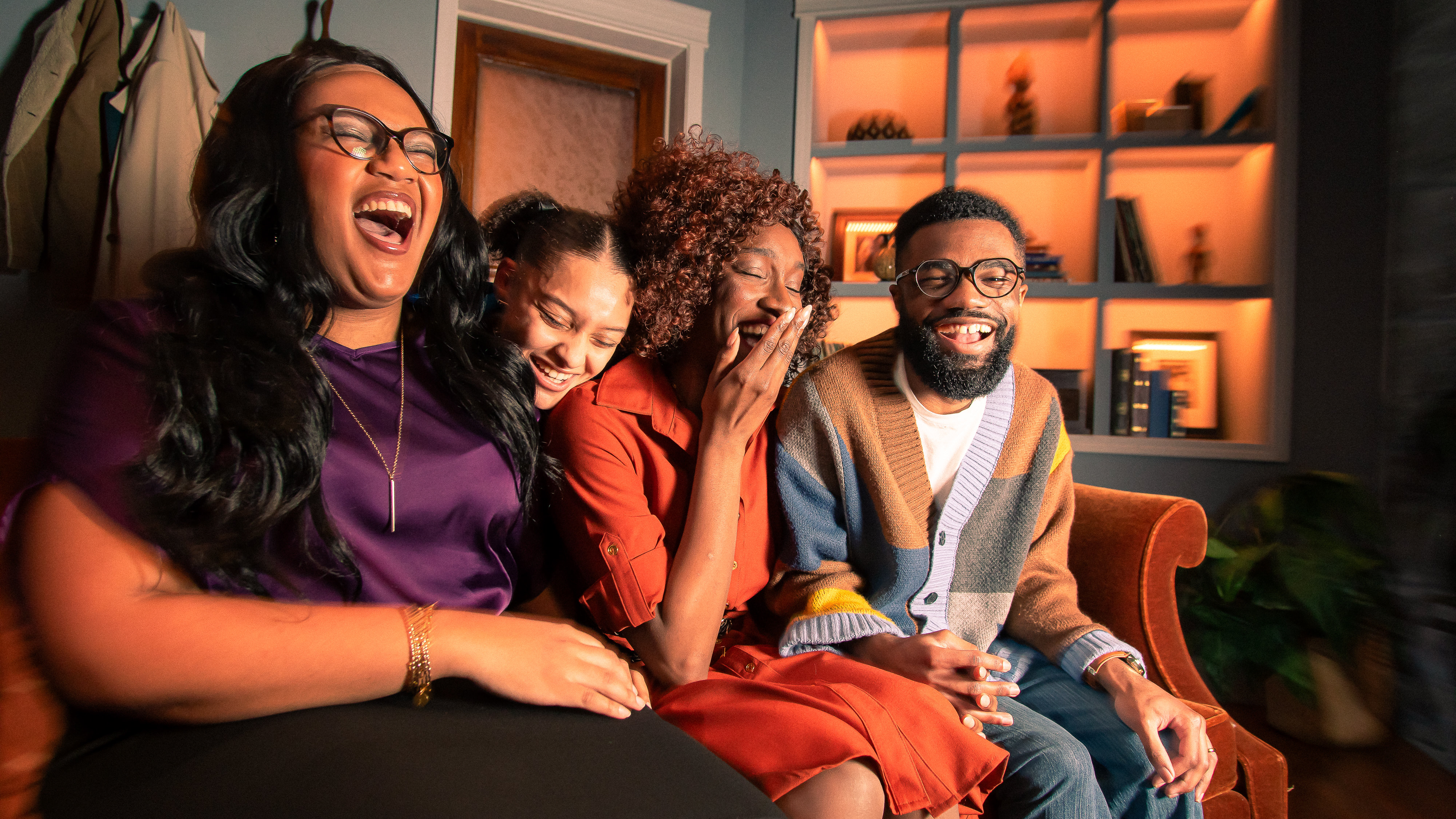Loyola Theatre Students laughing on a couch