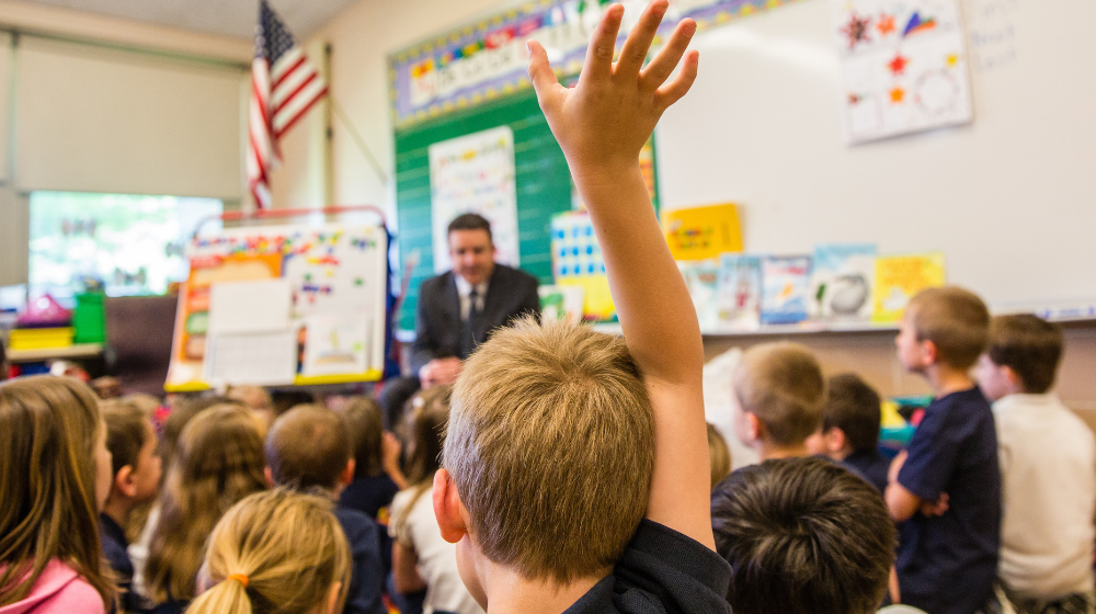 Loyola School of Education student teacher answering student questions