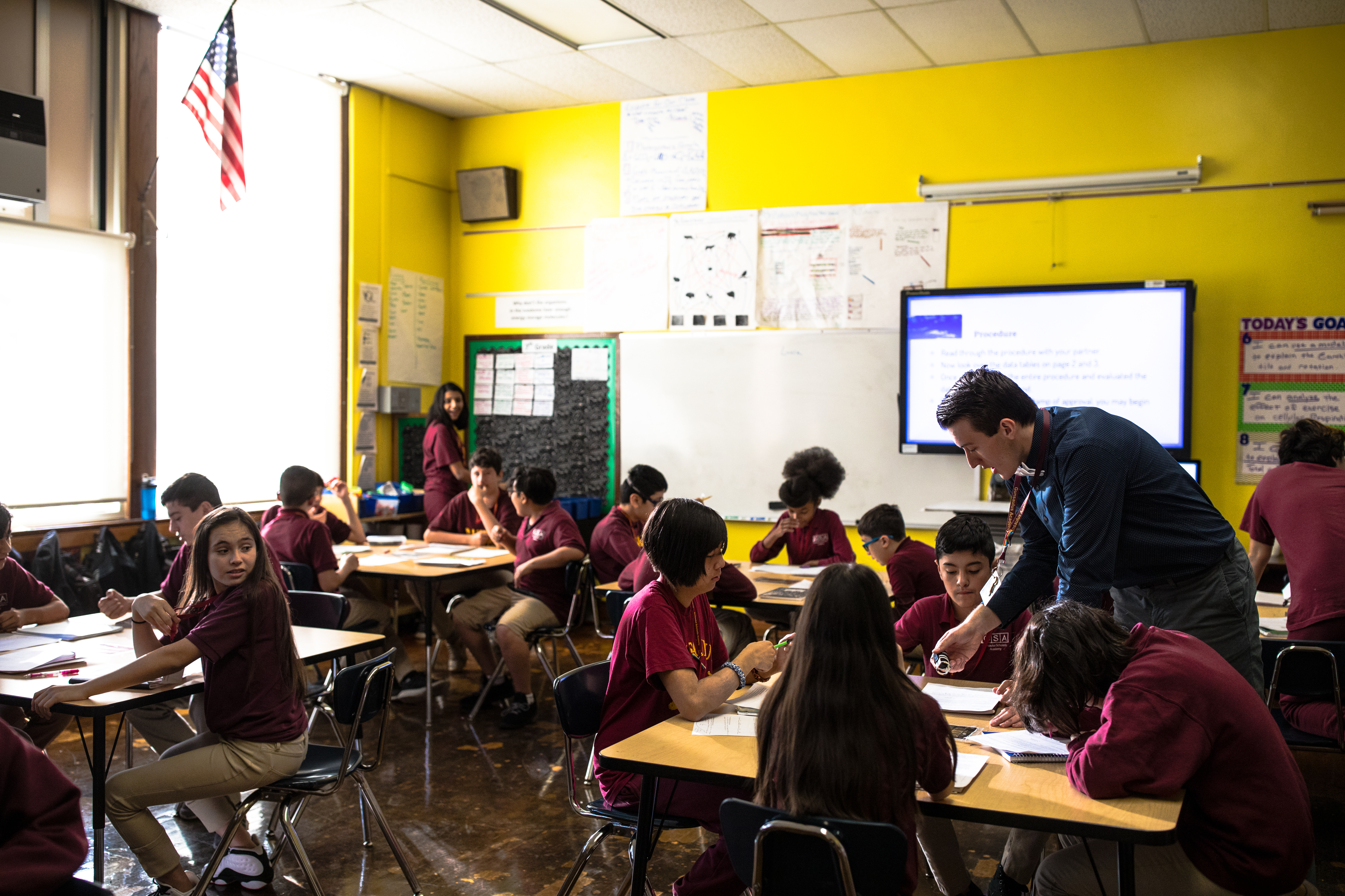 A teacher helping his students.