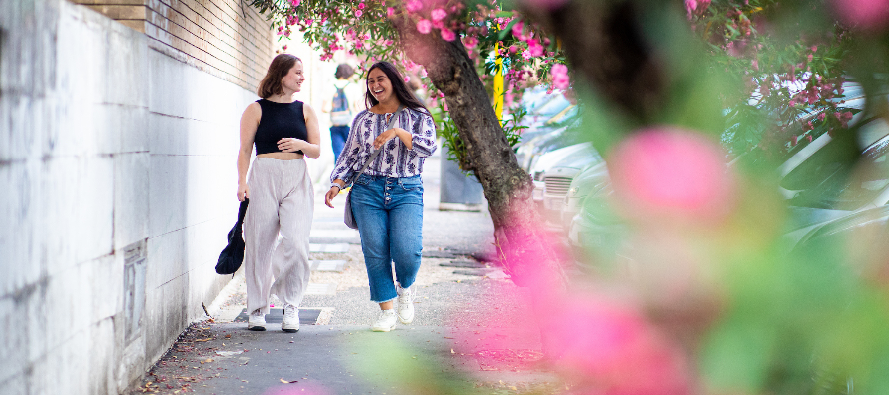 Loyola Chicago School of Education study abroad students walking on the sidewalk in Rome