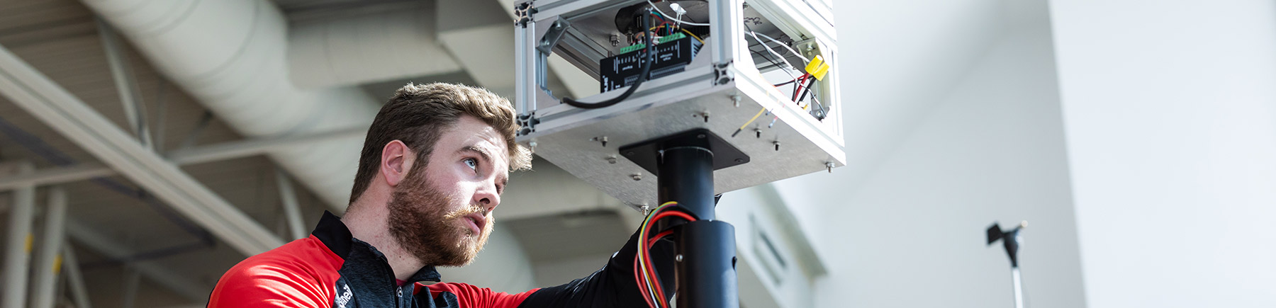 Engineering student works on technical project in flex lab