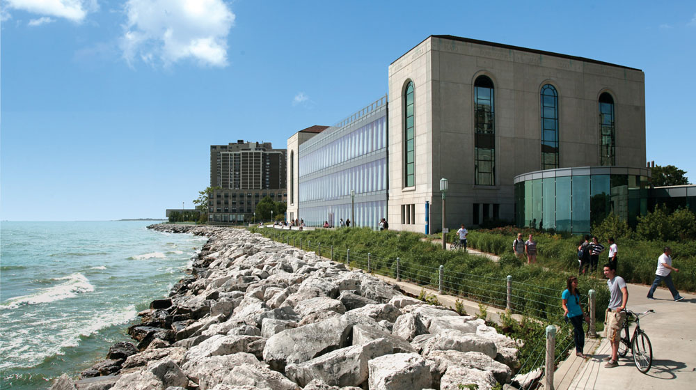 Loyola University Chicago Information Commons building along the lake on a clear day. Loyola University Chicago Information Commons building along the lake on a clear day.