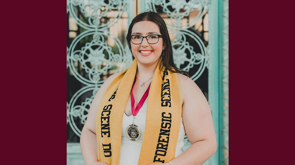 A person wearing a yellow scarf and glasses A person wearing a yellow scarf and glasses