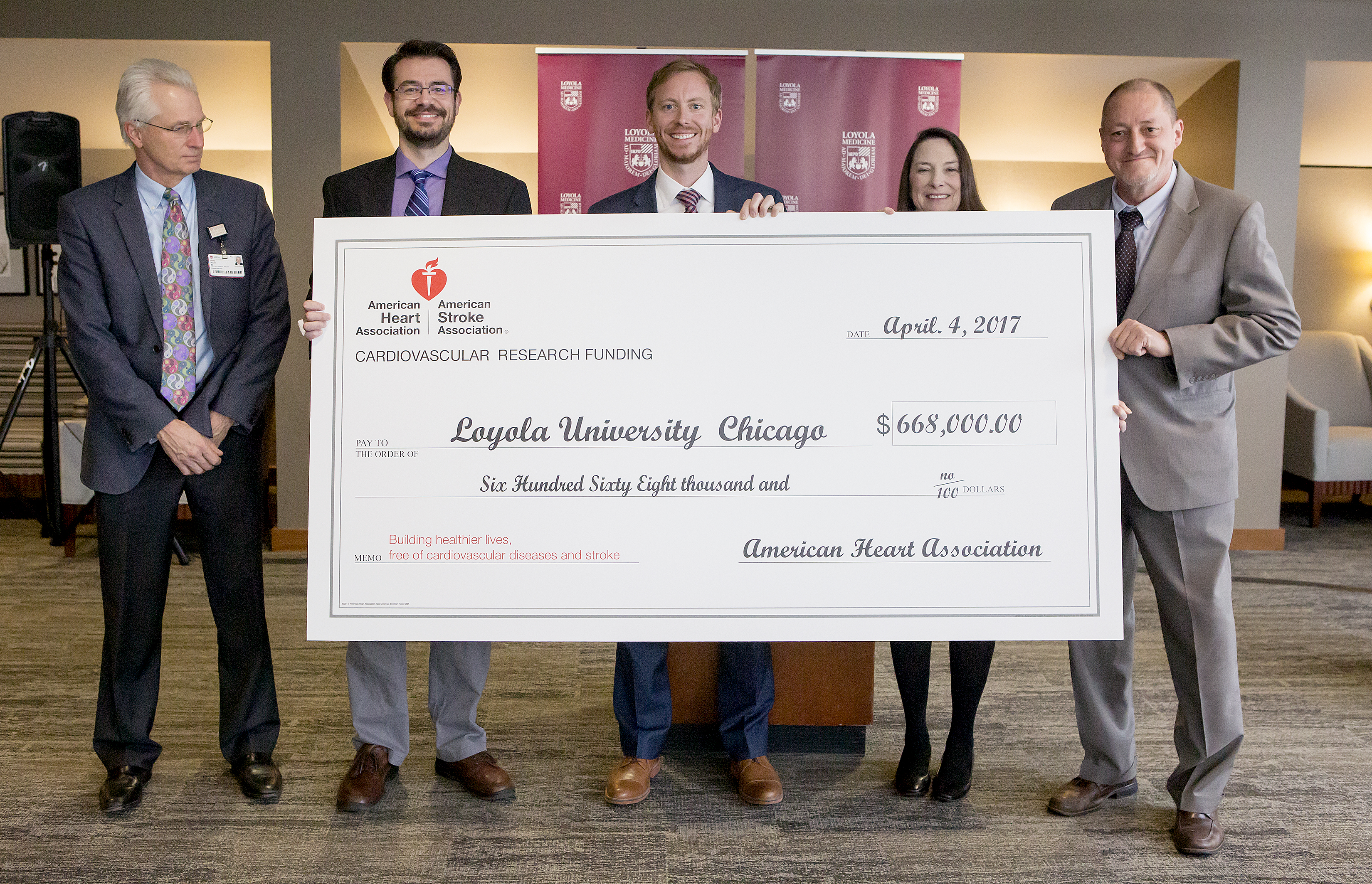 American Heart Association presents Loyola with a symbolic check for $668,000