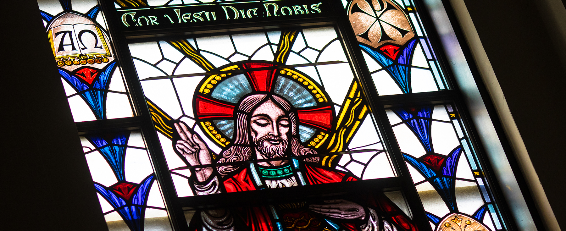 A stained glass portrait of Jesus Christ with 