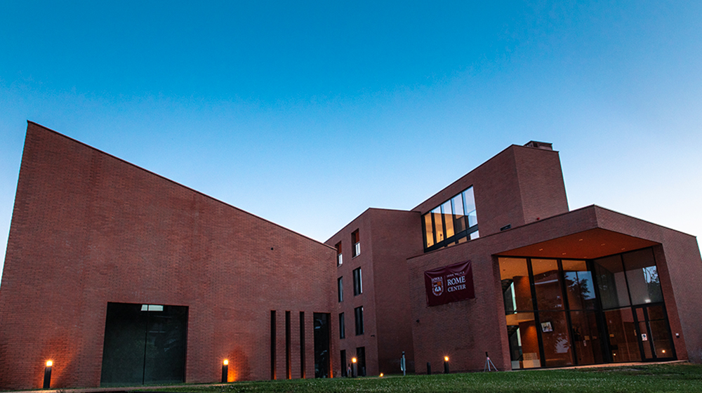 Exterior of The Rome Center building during sunset