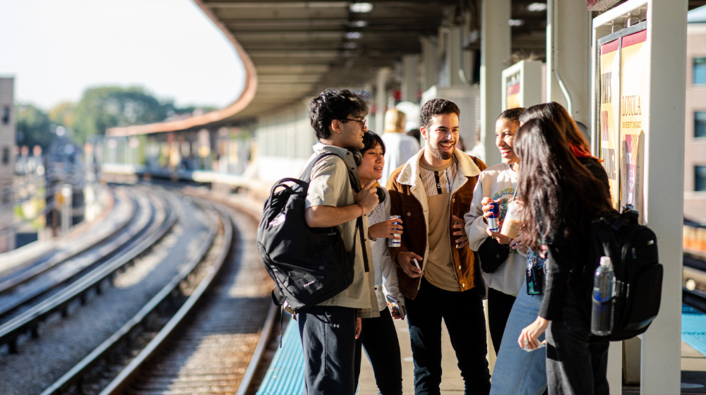 Students waiting for the train at a Red Line platform