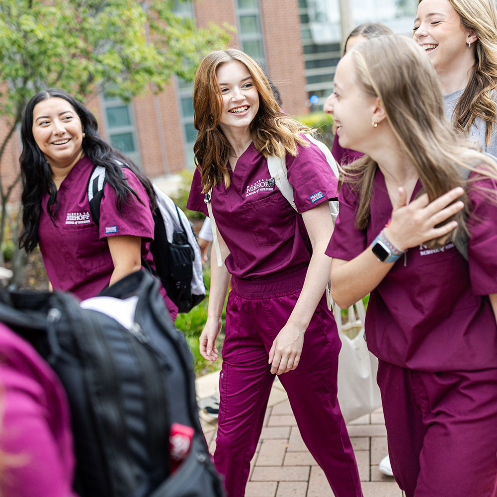 Student nurses walking together on the Loyola University Chicago campus