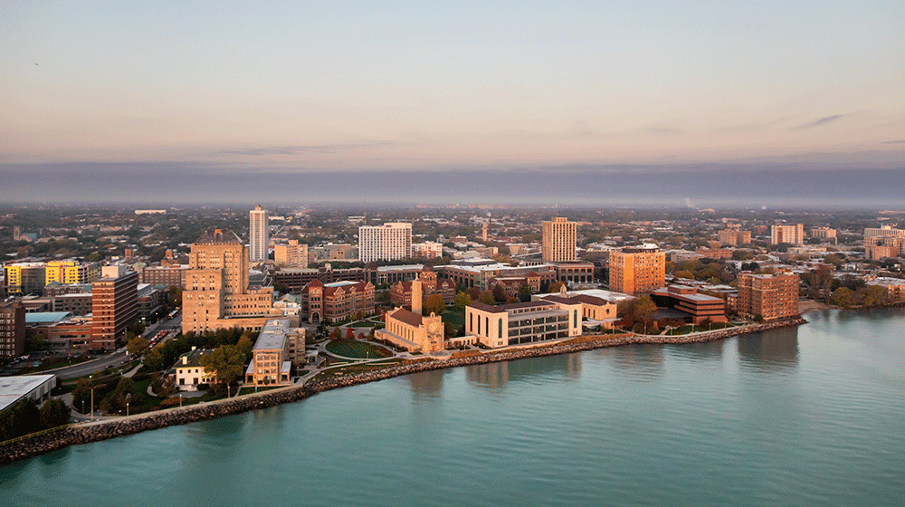An aerial view of the Lake Shore Campus skyline, looking west from Lake Michigan