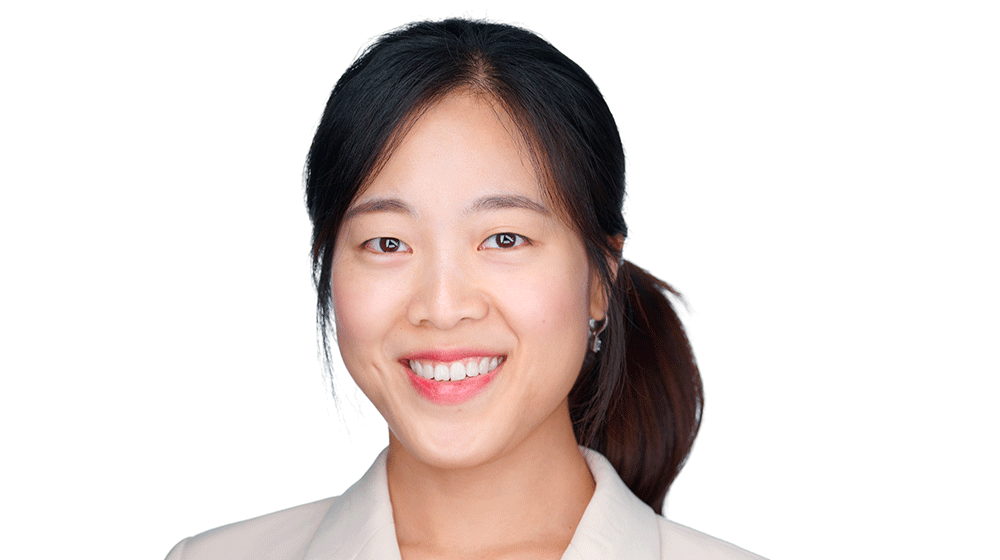 Headshot of Sueyeon Lee, smiling and wearing an off-white blazer Headshot of Sueyeon Lee, smiling and wearing an off-white blazer