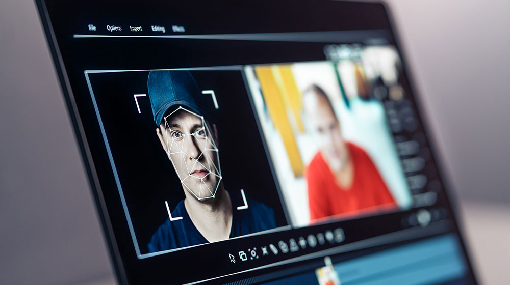 Computer screen showing human face edited with software