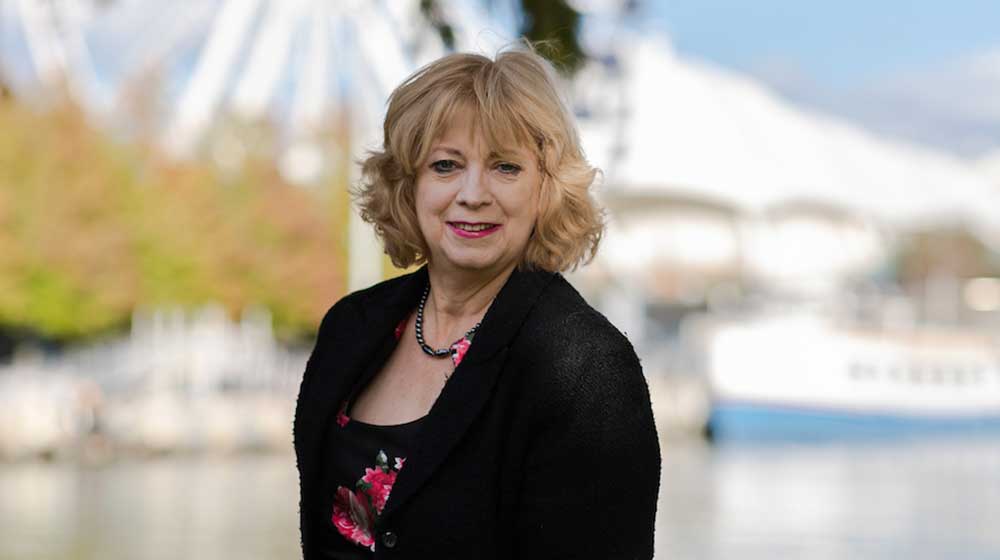 Cindy Bertram by a boat at Chicago's Navy Pier