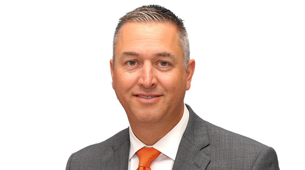 Headshot of Dan William. He is wearing a suit and tie. Headshot of Dan William. He is wearing a suit and tie.