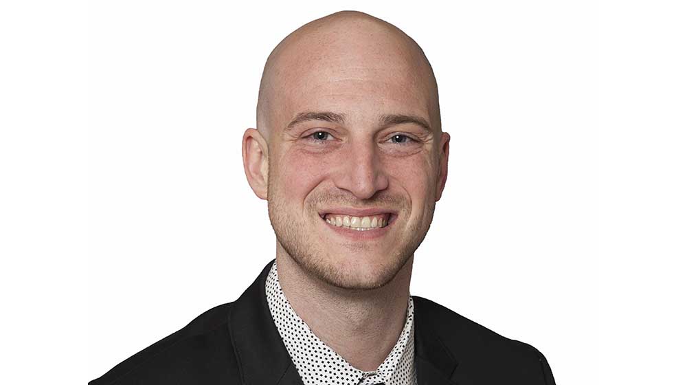 Headshot of Zach Binkley on a white background