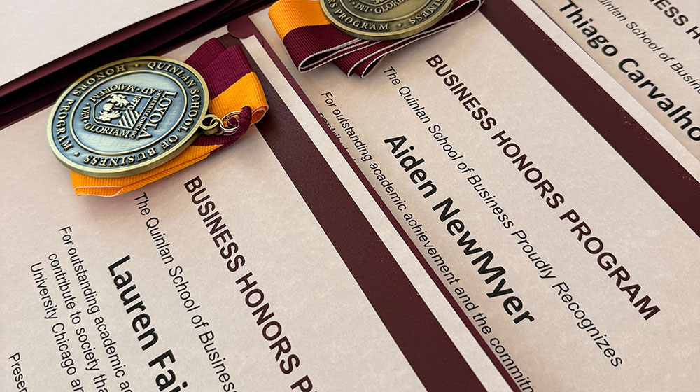 Medals presented to business honors students
