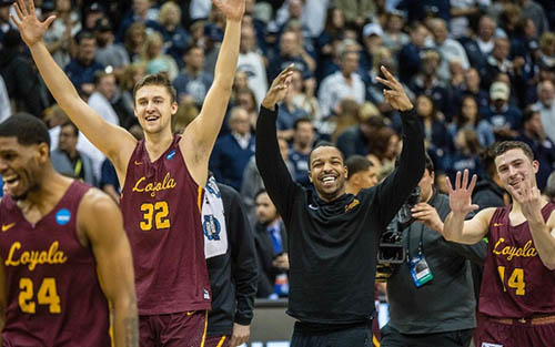 Basketball players celebrating on court