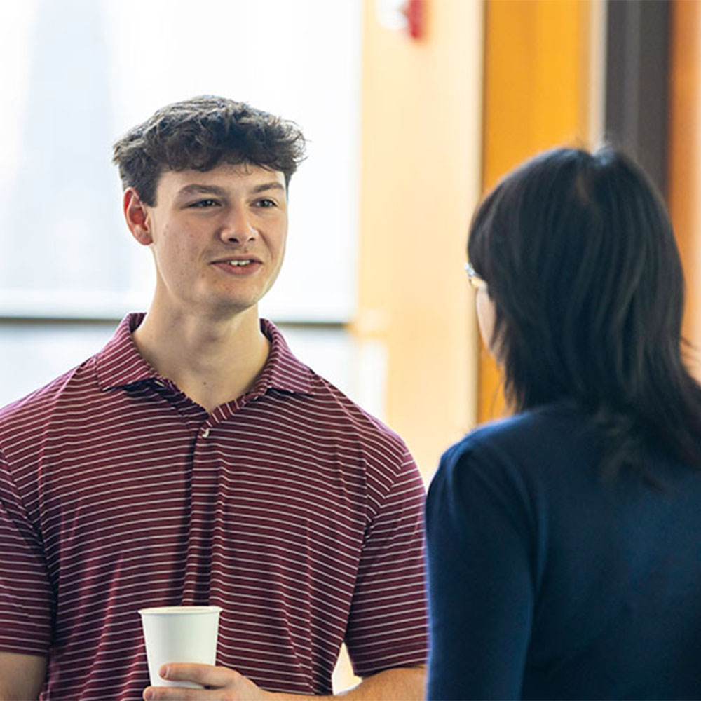 A student chats with a faculty memeber