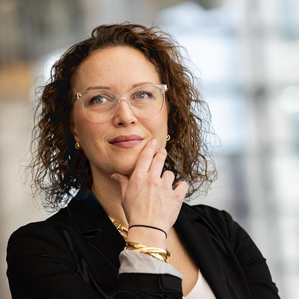 Jenna Drenten stands and thinks in the Schreiber Center