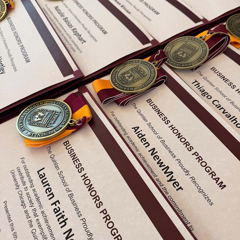 Medals for business honors students on a table