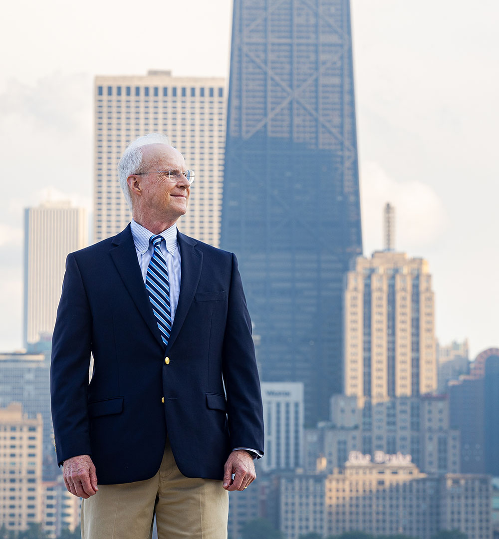 Cliff Shultz stands with the Chicago Skyline in the background