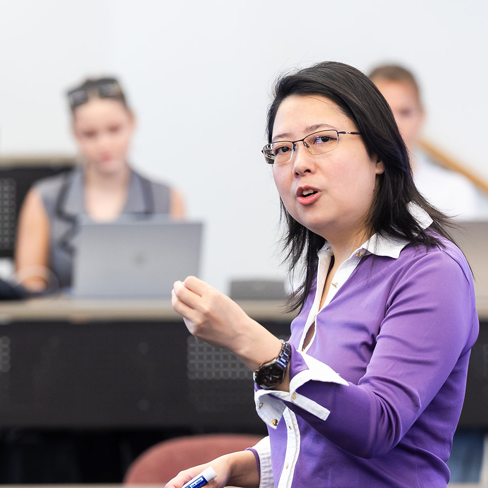 Zongfei (Lisa) Yang speaks to a classroom