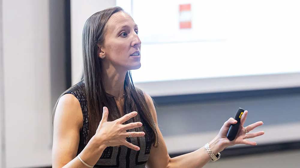 Prof. Brittney Bauer lecturing in class