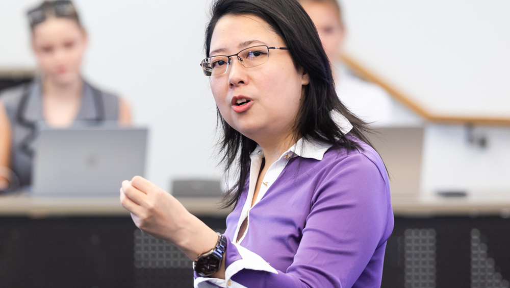 Zongfei Lisa Yang engages with students as she teaches in the classroom.