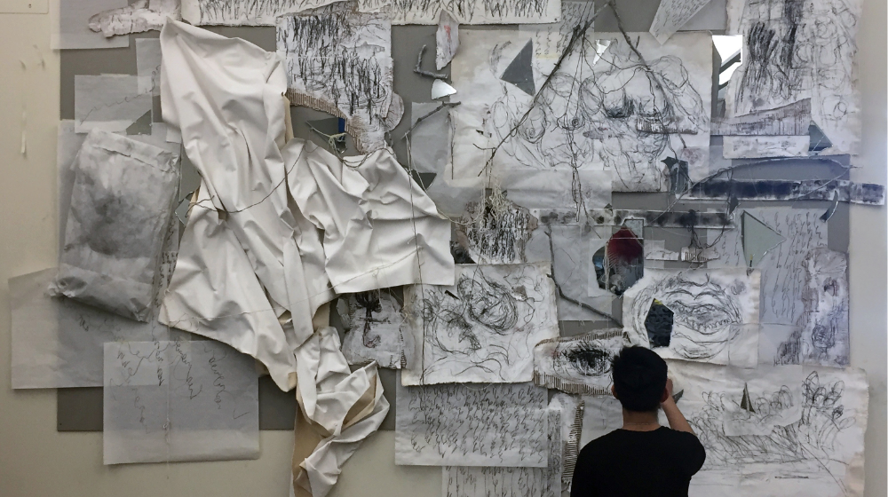 Student working on collaborative project in FNAR 213