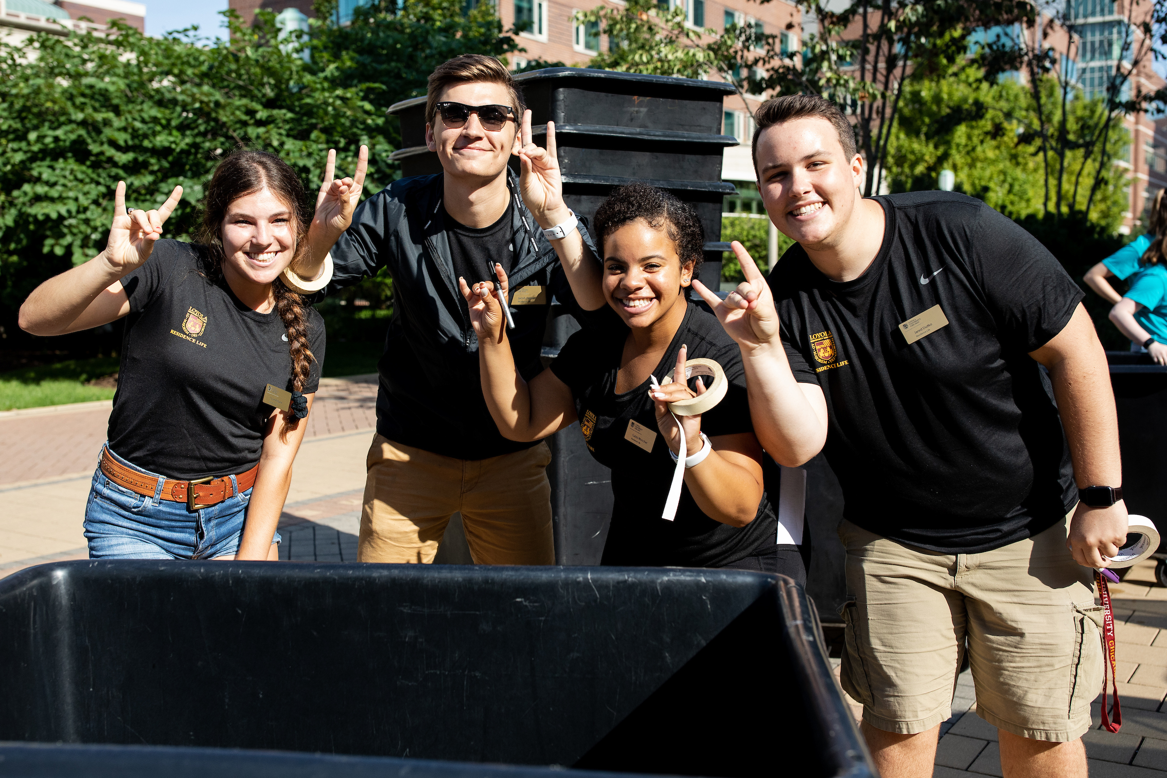 Four students smiling during the 2019 move in day Four students smiling during the 2019 move in day