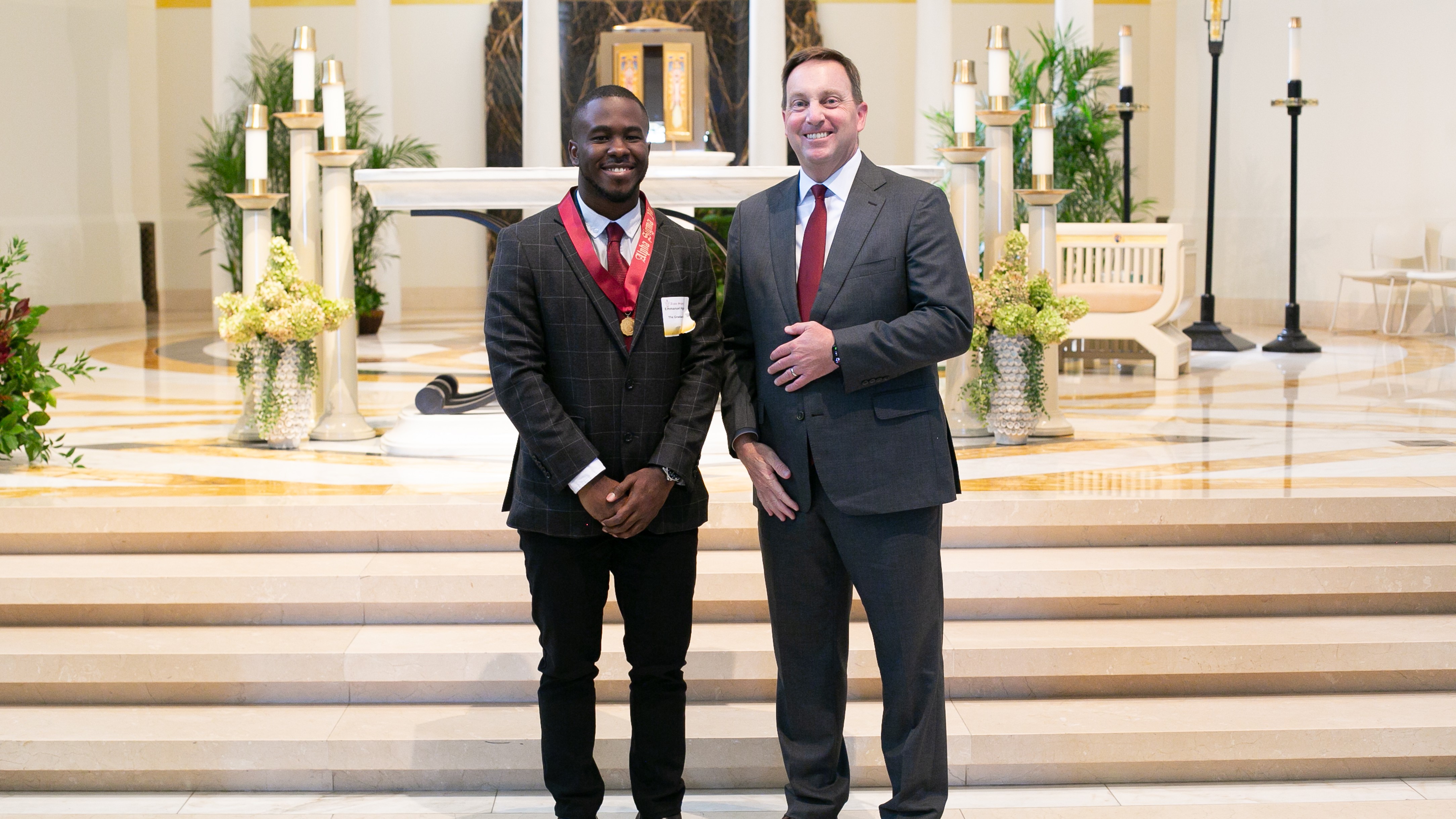 Student inductee with President Reed