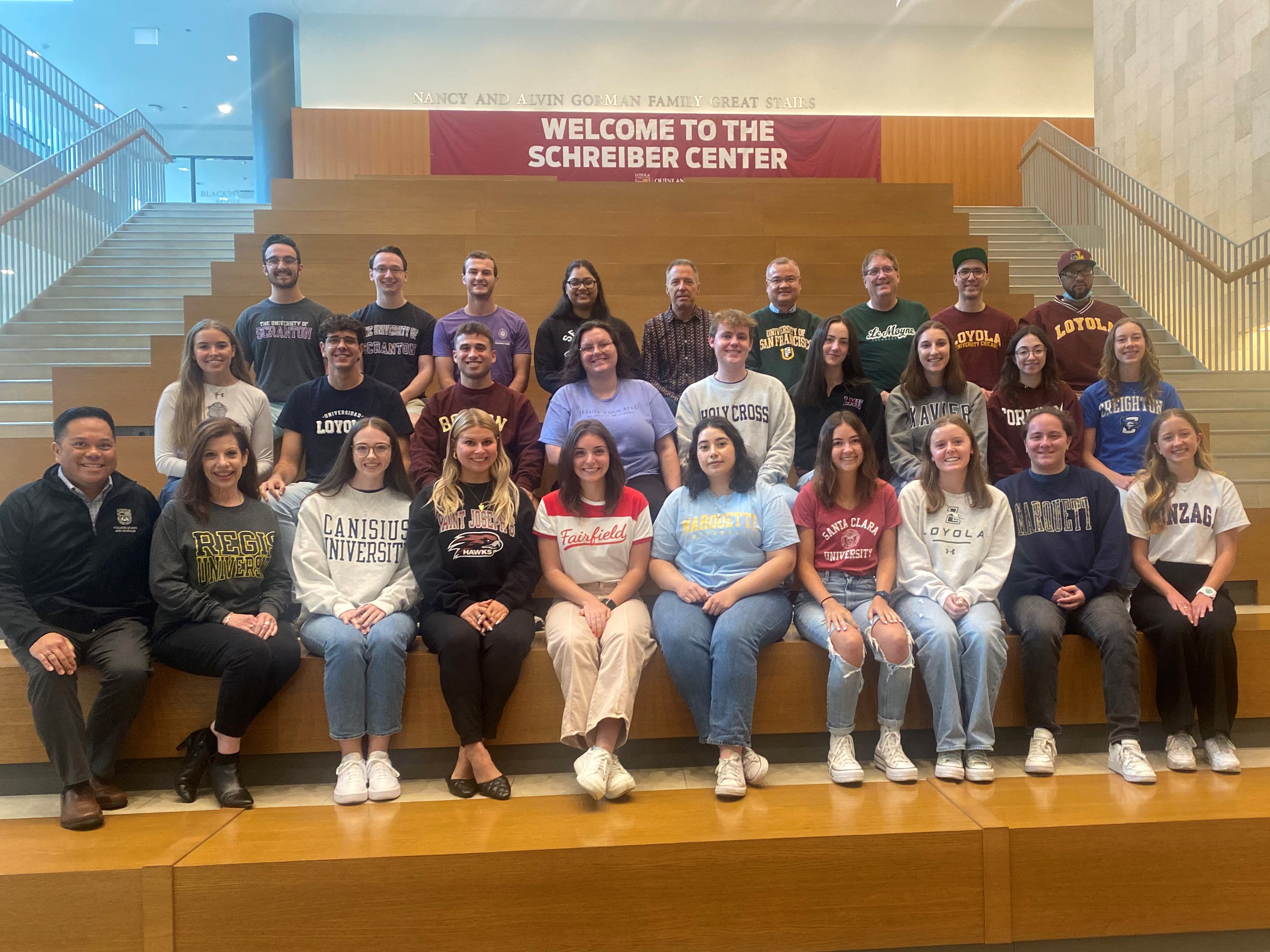 Image of chapter officers and chapter advisers wearing apparel with their college/university names and colors.