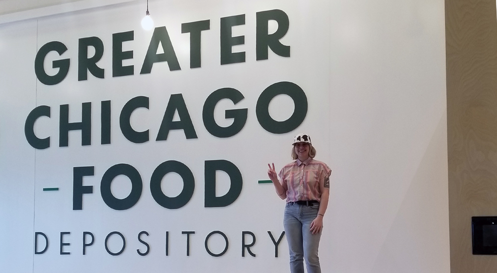 Jillian Musielak, the SOC’s Technology Coordinator, volunteers to pack boxes of food at the Greater Chicago Food Depository.