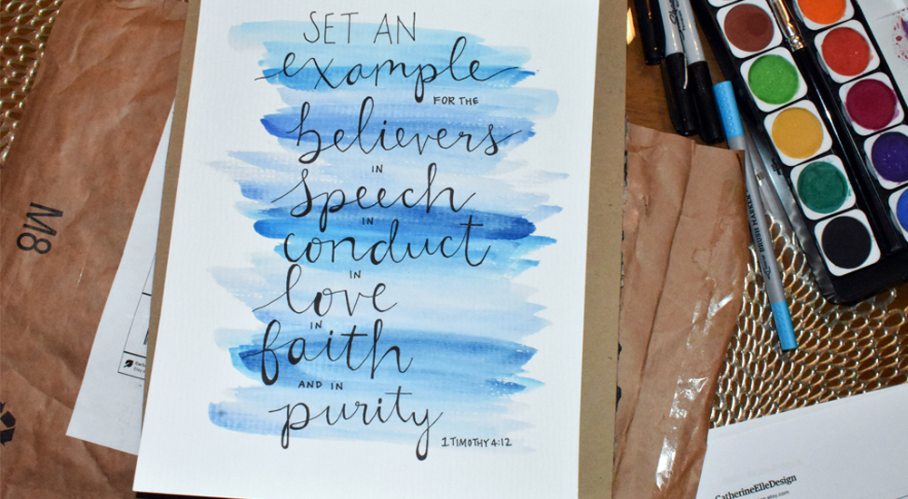 Van Grinsven paints posters and postcards with inspirational Bible passages to send to her friends.