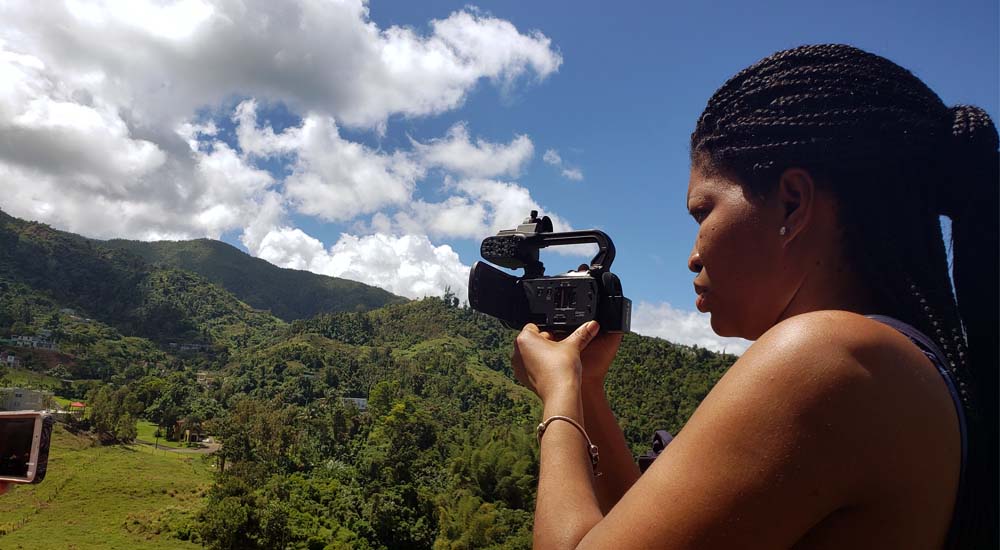 Finisha O'Quinn, a student in the Digital Media and Storytelling graduate program, shoots video at a nature preserve in Puerto Rico.