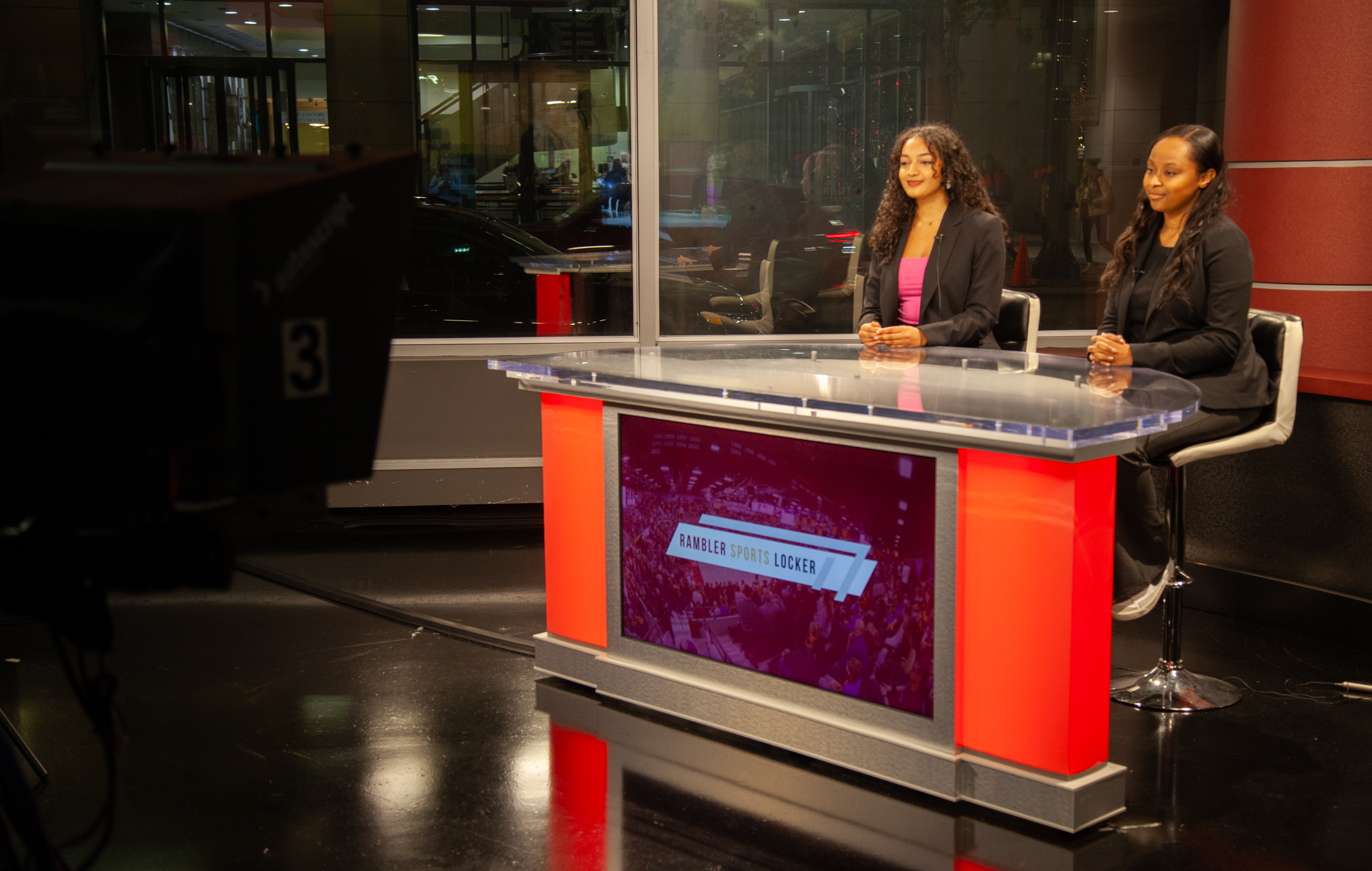 The SOC’s new anchor desk has state-of the art features such as lighted columns that change colors and a 50-inch LED smart TV in front that can display video and graphics. Photo by Jamason Chen