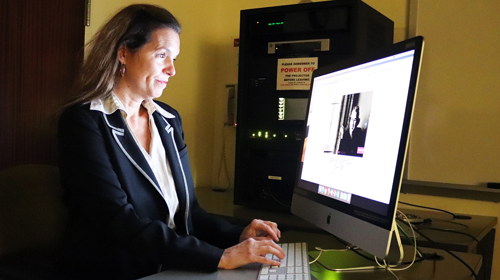 Dr. Elizabeth Coffman edits a portion of her award-winning documentary, Flannery. Photo by Sydney Owens.