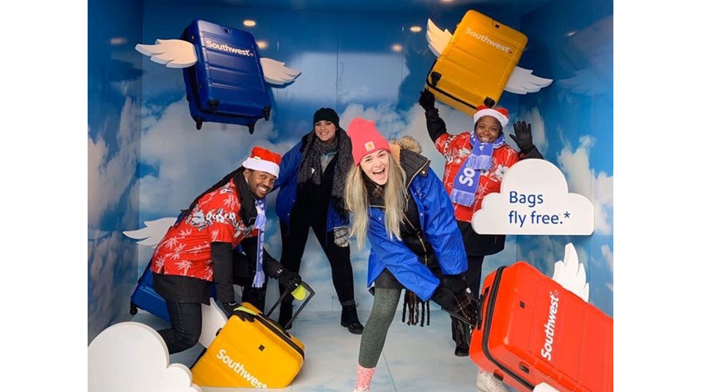 Loyola students Kelly Klusczinski (foreground) and Hannah Foster (rear) have fun in the Southwest Airlines photo booth. Photo by Hannah Foster.
